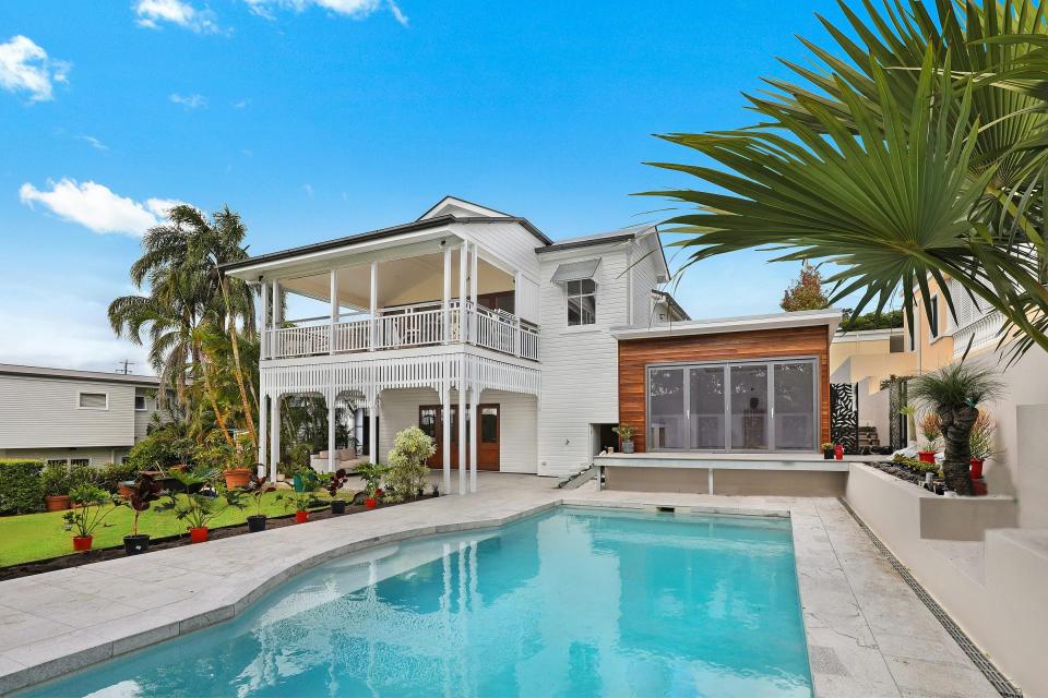 Luxury home with a pool and lush garden